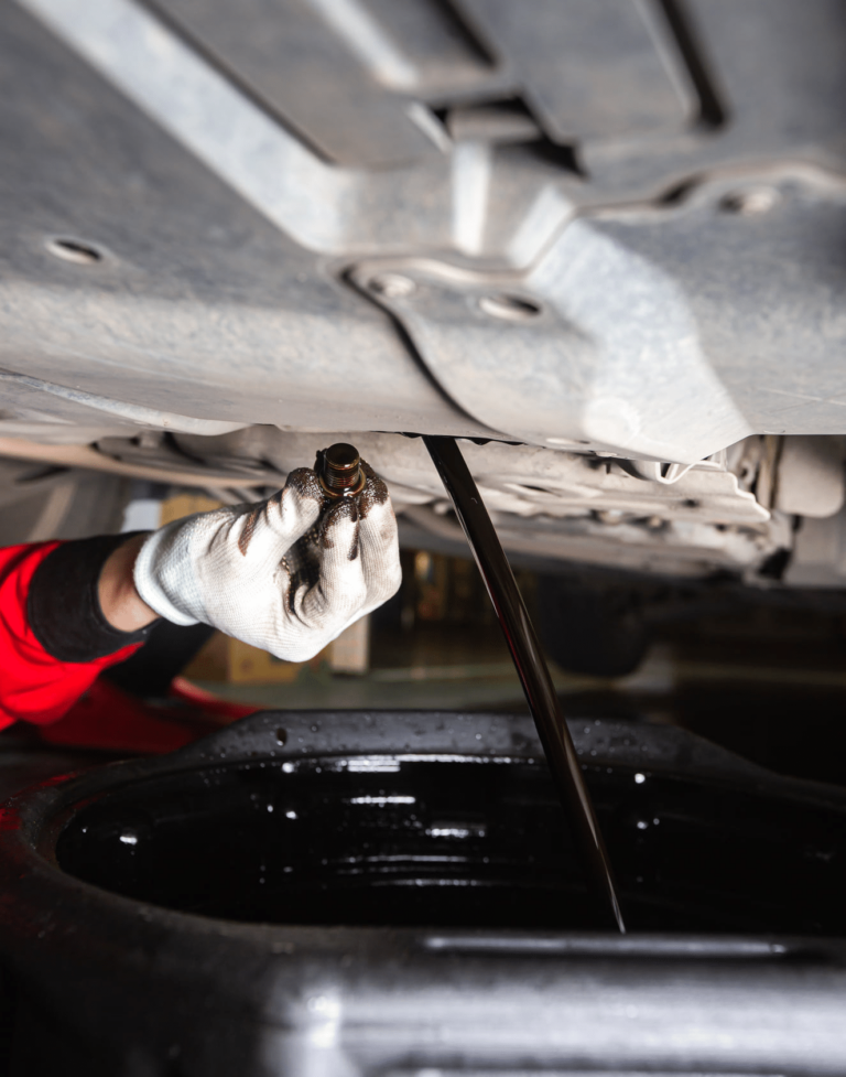 A person checking the engine of a car