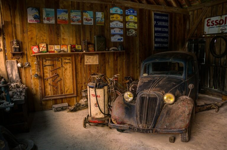 Old Car getting oil changed in old school garage