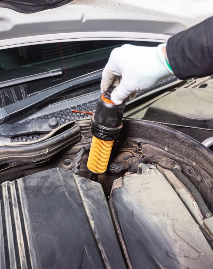 Re-installing the new oil filter into a Mercedes-Benz e350