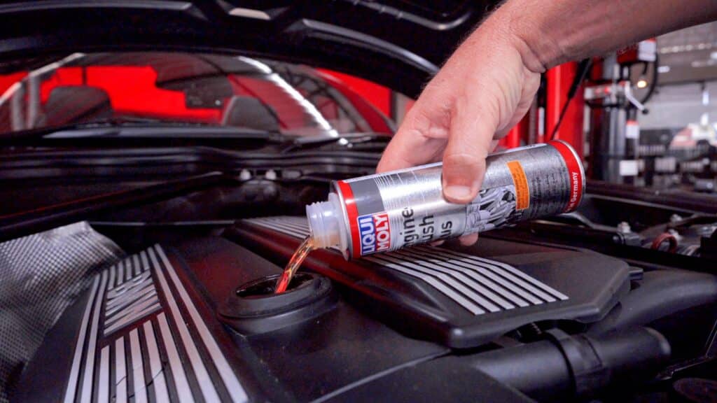 Pouring Liqui Moly Engine Flush Plus Into engine oil reseviour