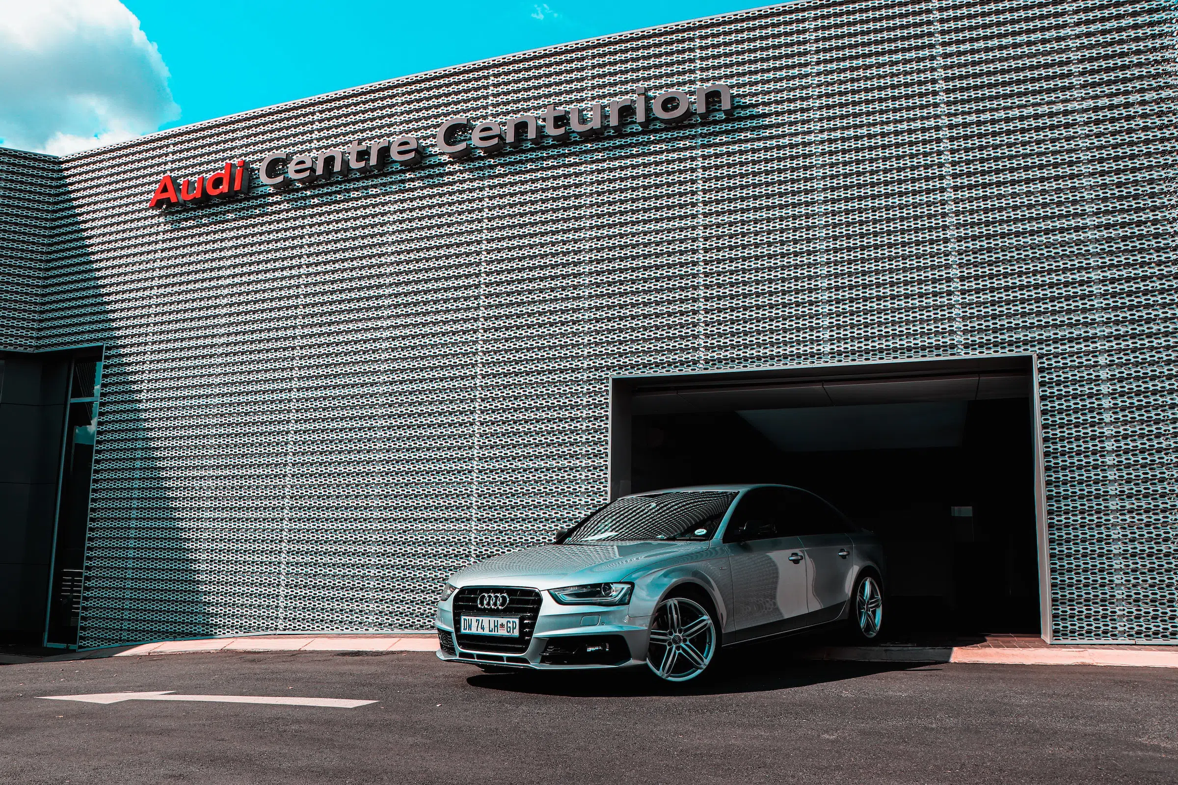 A silver Audi leaving the Audi Centre Centurion