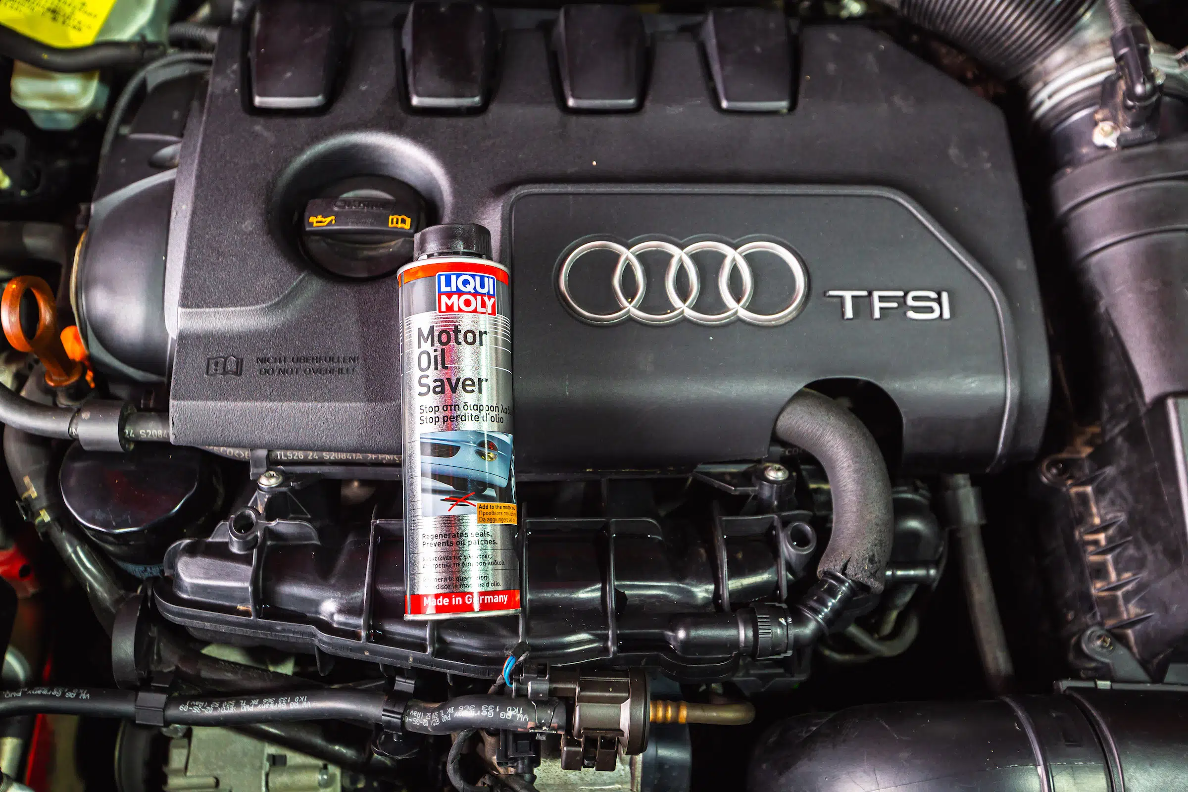 An Audi A3 TFSI engine with a bottle of LIQUI MOLY Motor Oil Saver