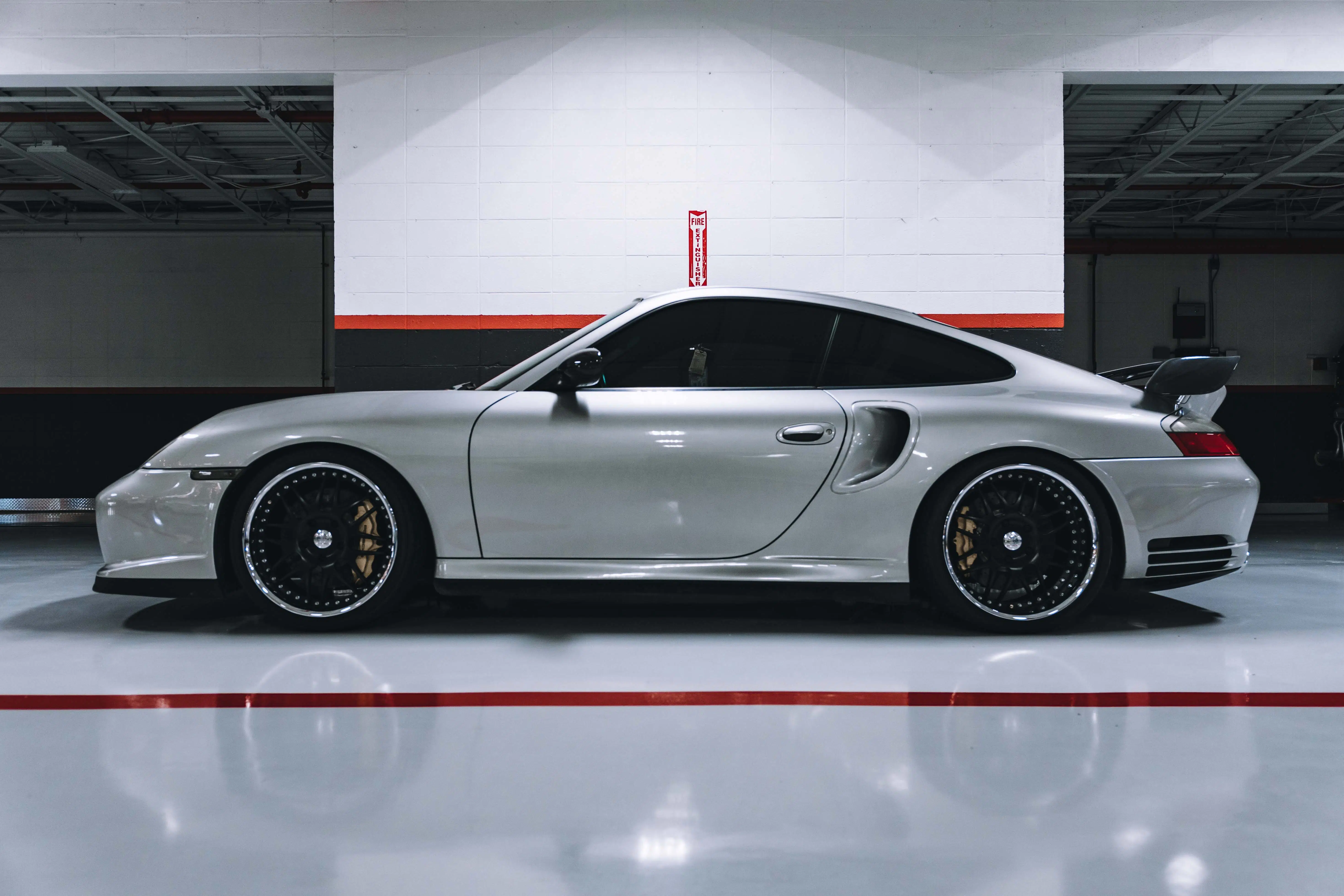 Porsche 911 white in garage