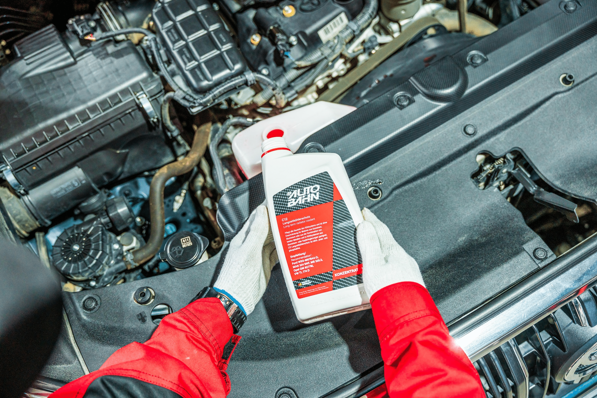 A car with its coolant, power steering and oil level checked