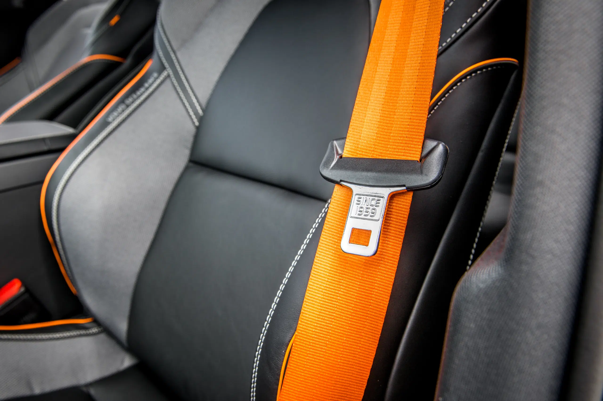 A car with seatbelts and dashboard warning lights